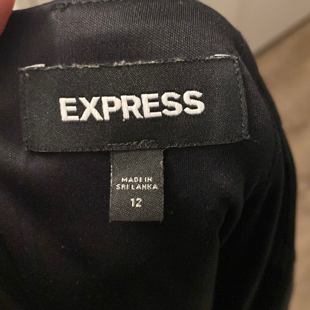 Black express suit skirt only worn 3 times. I lost Weight so it is too big